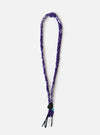 Hanami of Rome Purple/Black Leather/Turquoise Bead Bandana Necklace No.54 on a white background. The necklace features a purple and white braided band with black leather and a turquoise bead.