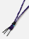 Hanami of Rome Purple/Black Leather/Turquoise Bead Bandana Necklace No.54 on a white background. The necklace features purple bandana fabric, black leather strands, and a turquoise bead.