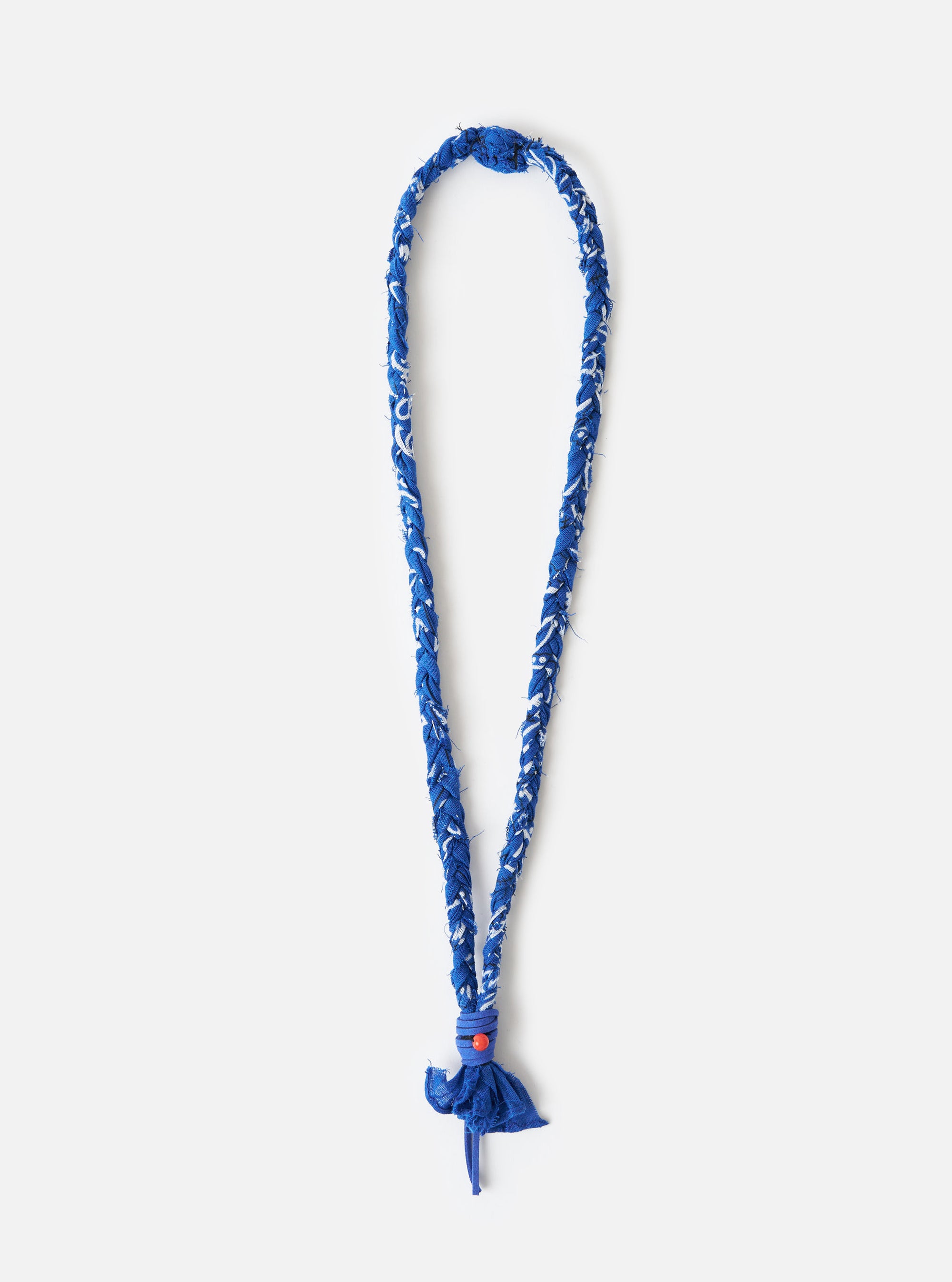 Hanami of Rome Blue Royal Leather/Peach Bead Bandana Necklace No.55 on a white background. The necklace is blue and white braided material with a peach bead.
