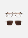 A. SOCIETY x Universal Works Brown/Honey Kowloon Eyewear on a white surface. The glasses have a brown and honey-colored frame. Below are sunglasses with a white frame and brown lenses.