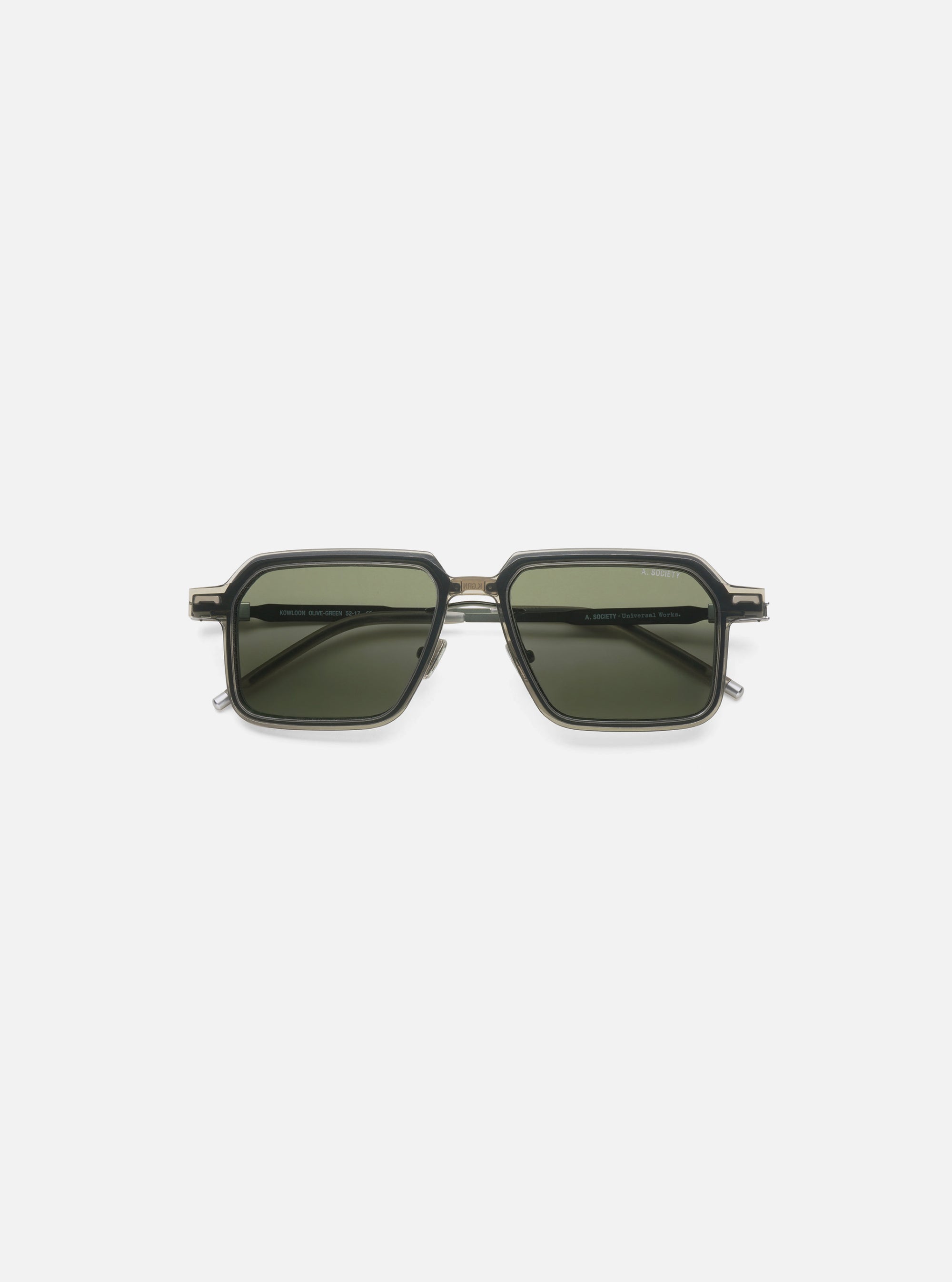 Close-up of A. SOCIETY x Universal Works Olive/Green Kowloon Eyewear on a white background. The frames are olive and green with dark green lenses.