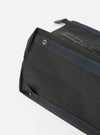 Close-up of the master-piece x Universal Works Black Recycled Tech Canvas Large Tote Bag. The black tech canvas material is visible with blue straps and silver rivets. Shot on a white background.