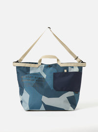 master-piece x Universal Works Blue Camo Recycled Tech Canvas Large Tote Bag on a white background. The bag features blue camo print and beige straps.