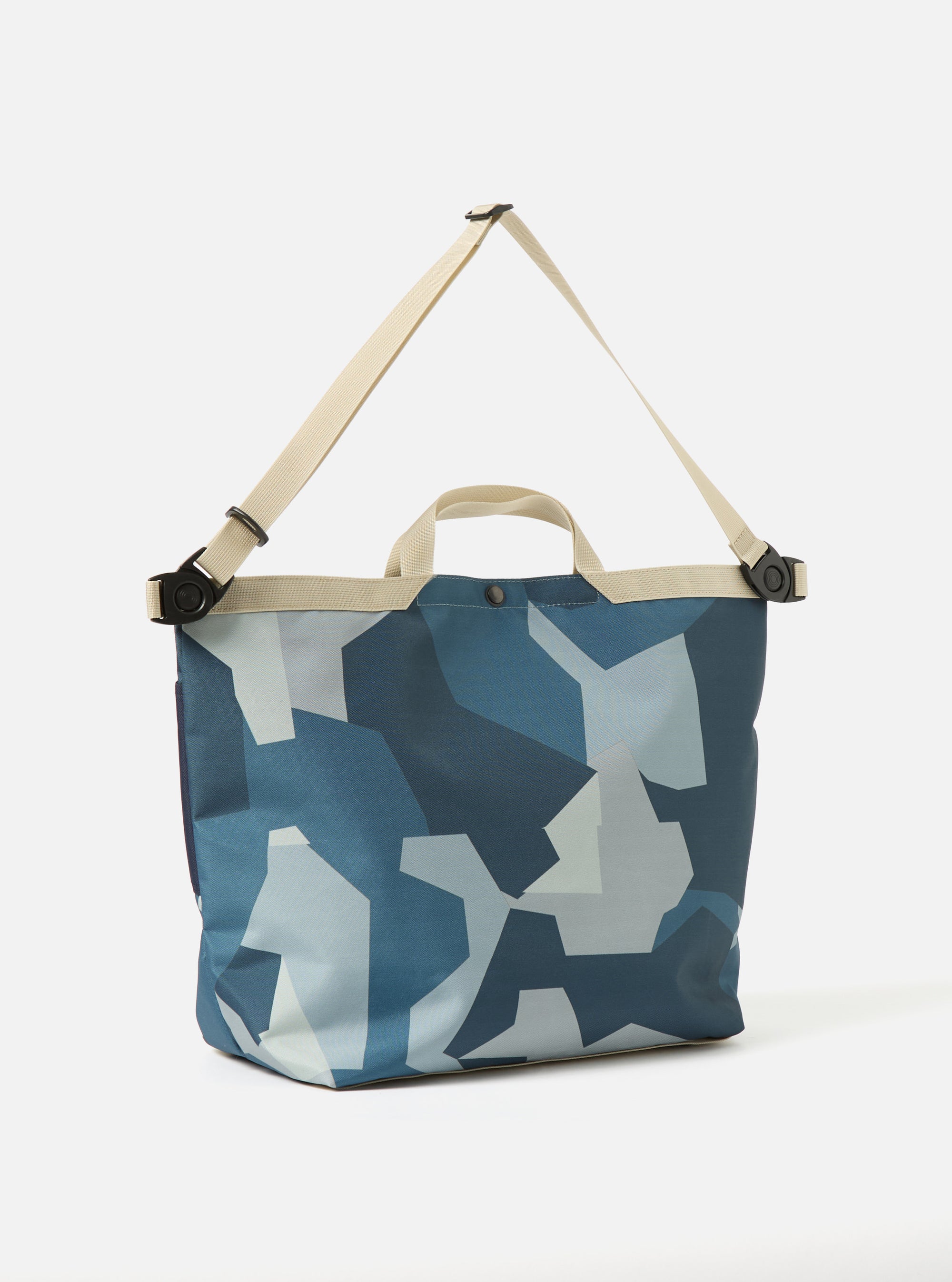 master-piece x Universal Works Blue Camo Recycled Tech Canvas Large Tote Bag on a white background. The bag features a blue camo pattern and beige straps.