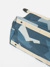 Close-up of a master-piece x Universal Works Blue Camo Recycled Tech Canvas Large Tote Bag on a white surface. The bag features a blue camo pattern and beige straps.