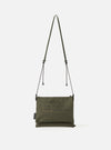 master-piece x Universal Works Olive Recycled Tech Canvas Sacoche on a clean white background. The olive green bag features black drawstrings and subtle branding.
