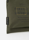 Close-up of the master-piece x Universal Works Olive Recycled Tech Canvas Sacoche on a white background. The olive canvas features printed text and a small brand tag.