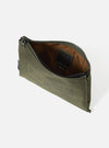 Olive master-piece x Universal Works Recycled Tech Canvas Sacoche. The bag is on a white surface, showing the inside lining and zipper. The canvas has printed text.