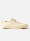 Side view of the Novesta for Universal Works Ecru Canvas Star Master shoe on a white background. The shoe is made of ecru canvas with a rubber sole.