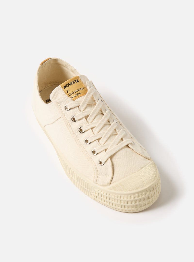 Studio shot of the Novesta for Universal Works Ecru Canvas Star Master. The ecru canvas shoe is on a white background.