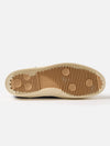Close-up of the sole of the Novesta for Universal Works Navy Canvas Star Master shoe, showing the brown rubber sole with a textured pattern, on a white background.
