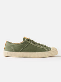 Side view of a Novesta for Universal Works Olive Canvas Star Master shoe on a white background. The shoe is olive green with a cream sole and laces.