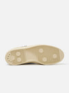 The Novesta for Universal Works Black/Pale Blue Canvas Star Master is shown from a side profile against a white background. The low-top sneaker features a black cotton canvas upper with contrast stitching, metallic eyelets, and a chunky ecru natural rubber sole with a textured tire-like finish on the toe cap. A prominent pale blue pull tab is located on the heel, and a dual-branded woven tag is visible on the tongue.
