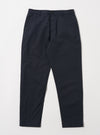 The Navy Linen Slub Weave Military Chino laid on a white surface. The pants are a dark navy color and made of a textured linen material. 