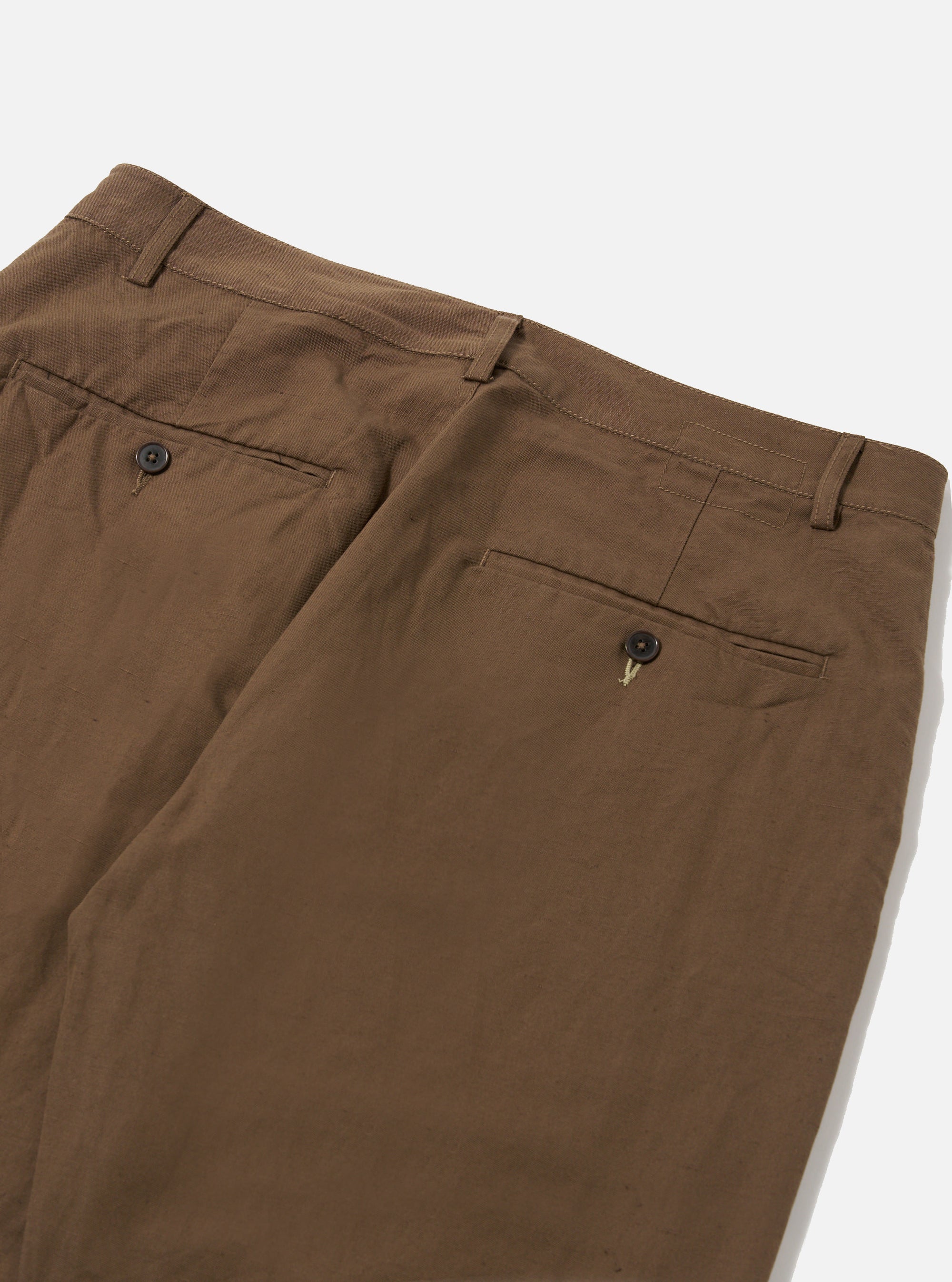Close-up of Khaki Linen Slub Weave Military Chino pants on a white background. The khaki color and linen texture are visible, showcasing the fit and material.