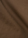 Close-up of the Khaki Linen Slub Weave Military Chino fabric. The material is a textured, earthy khaki color. The background is a simple, neutral surface.