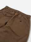Close-up of the back of Khaki Linen Slub Weave Oxford Pant on a white surface. Shows the elastic waistband, back pockets with button closures, and the slub weave texture of the linen.