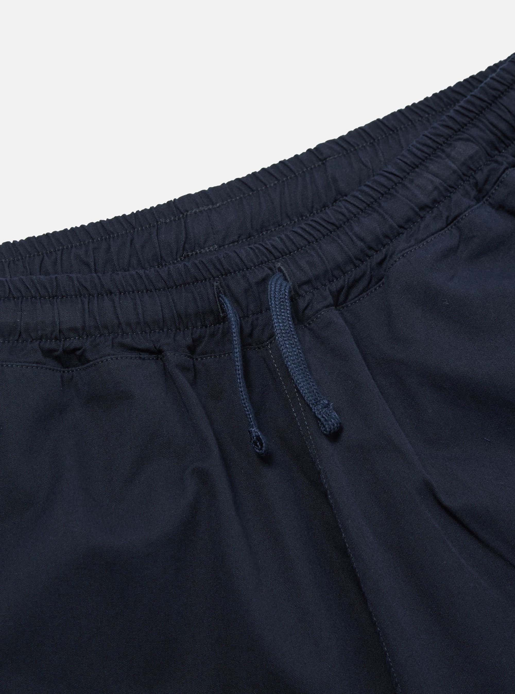 Close-up of the Navy Military Cotton Judo Pant on a white background, showing the elastic waistband with drawstring. The pants are a relaxed fit.