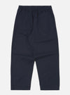 Studio shot of the Navy Military Cotton Judo Pant on a white background. These loose-fitting, navy cotton pants feature an elastic waist with a drawstring.