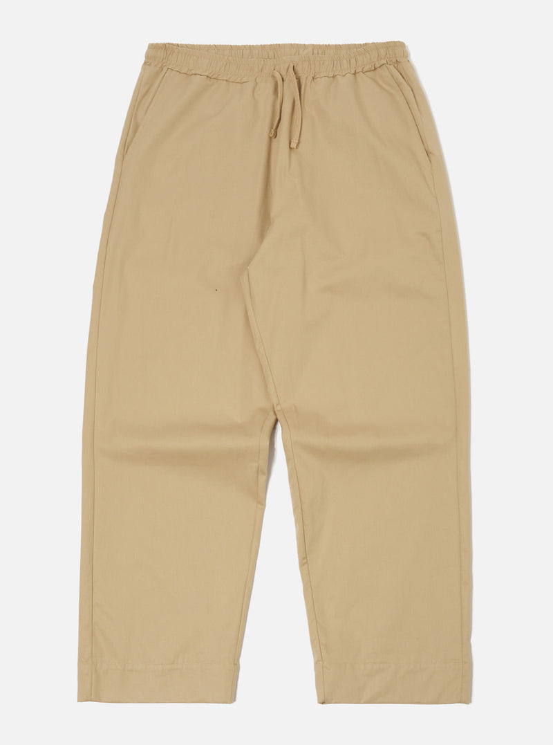 The Sand Military Cotton Judo Pant in sand color, made of cotton, laid flat on a white background. Features a drawstring waist and a relaxed fit.