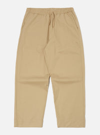 The Sand Military Cotton Judo Pant in sand color, made of cotton, laid flat on a white background. Features a drawstring waist and a relaxed fit.