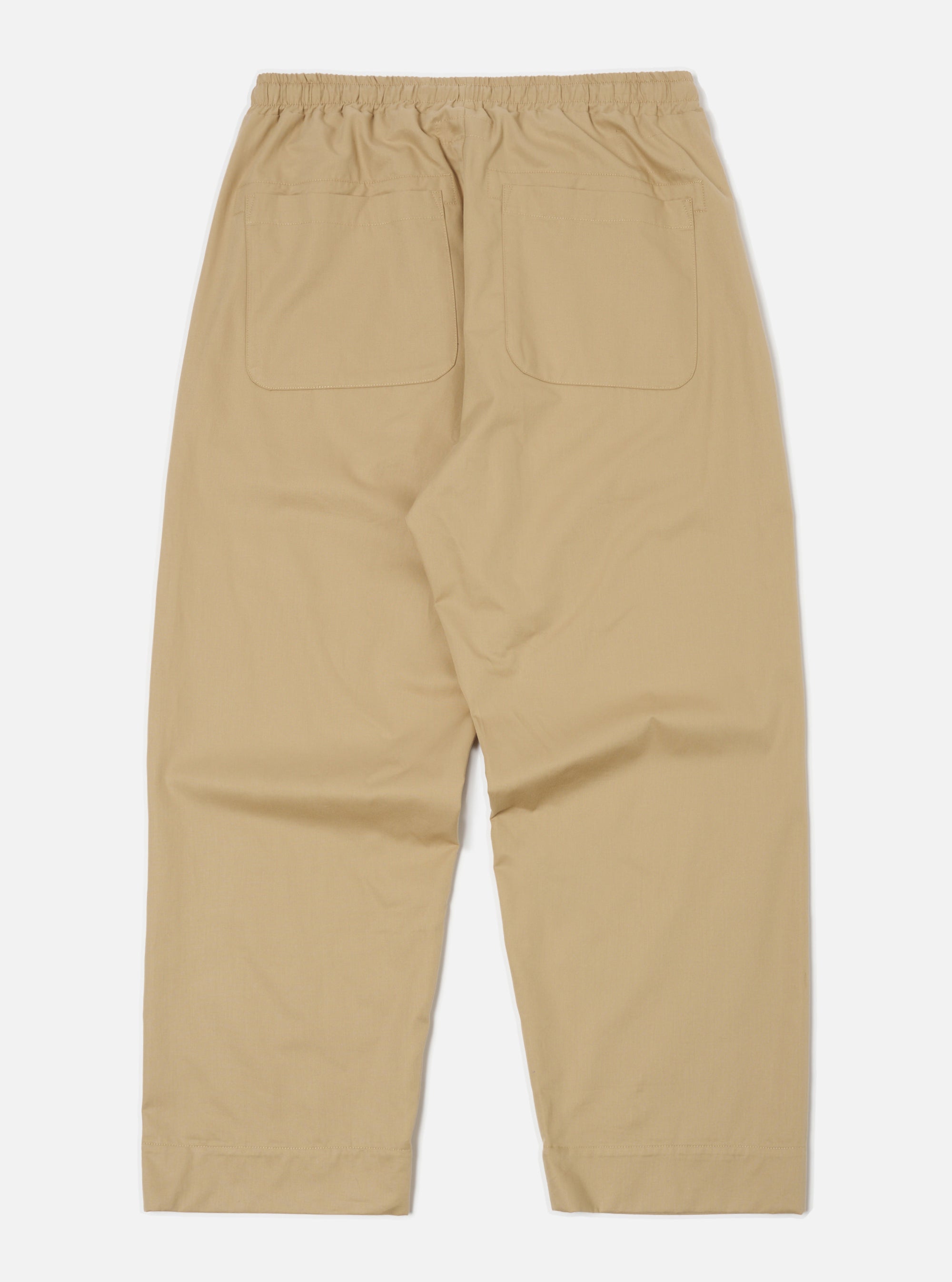 Back view of the sand military cotton Judo Pant on a white background. The pants are a relaxed fit with an elastic waistband and back pockets.