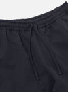 Close-up of the Navy Linen Slub Weave Simple Short, showcasing the elastic waistband with drawstring. The navy linen fabric is visible against a white backdrop.