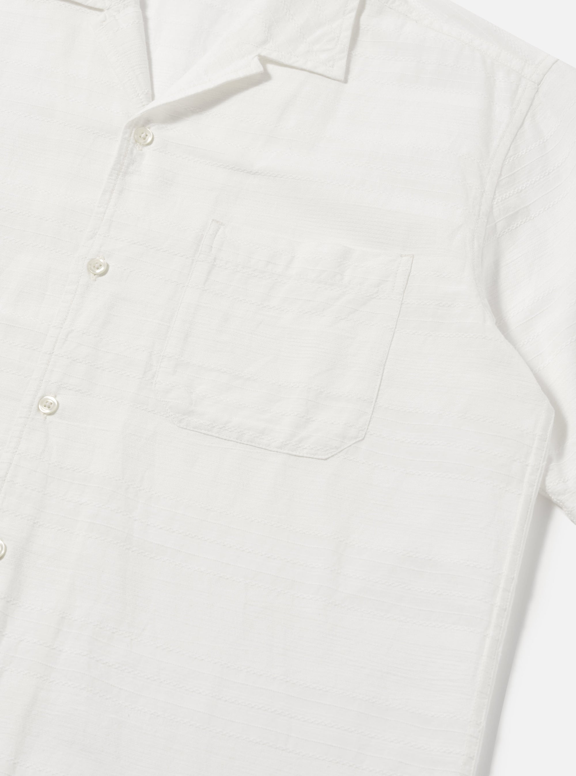 Close-up of the Ecru Deffe Self Stripe Minari Shirt on a white background. The shirt is ecru with subtle self stripes and has a relaxed fit.