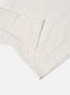 Close-up of the ecru Deffe Self Stripe Smock Overshirt on a white background. The light fabric shows subtle stripes and a relaxed fit.