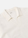 Close-up of the Ecru Deffe Self Stripe Smock Overshirt on a white background. The shirt is a light cream color with subtle stripes. The collar is open and the fabric is textured.