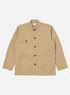 The Sand Military Cotton Dockside Overshirt in sand color. Made from cotton, it features a relaxed fit. Shot on a clean white background.