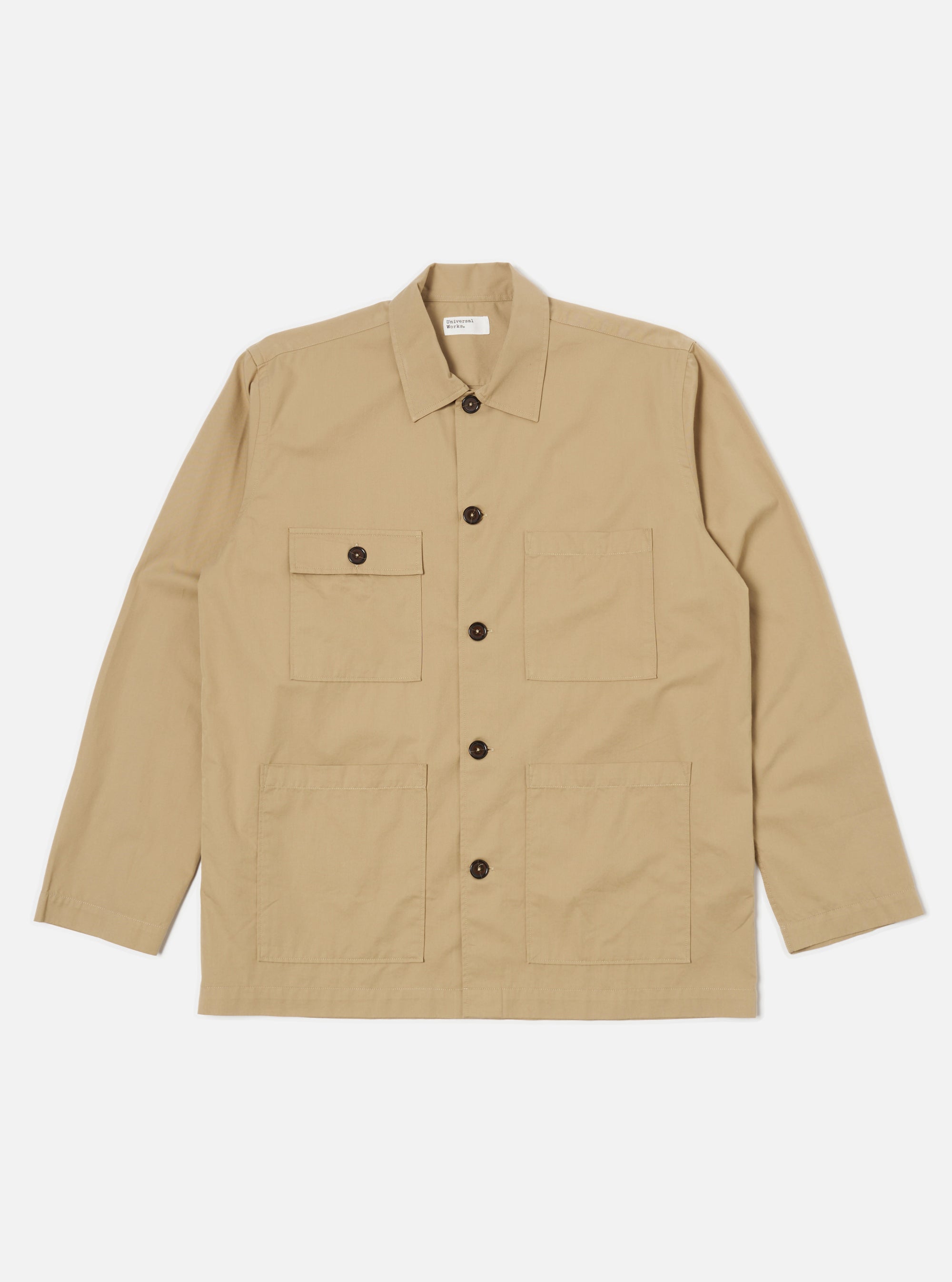 The Sand Military Cotton Dockside Overshirt in sand color. Made from cotton, it features a relaxed fit. Shot on a clean white background.