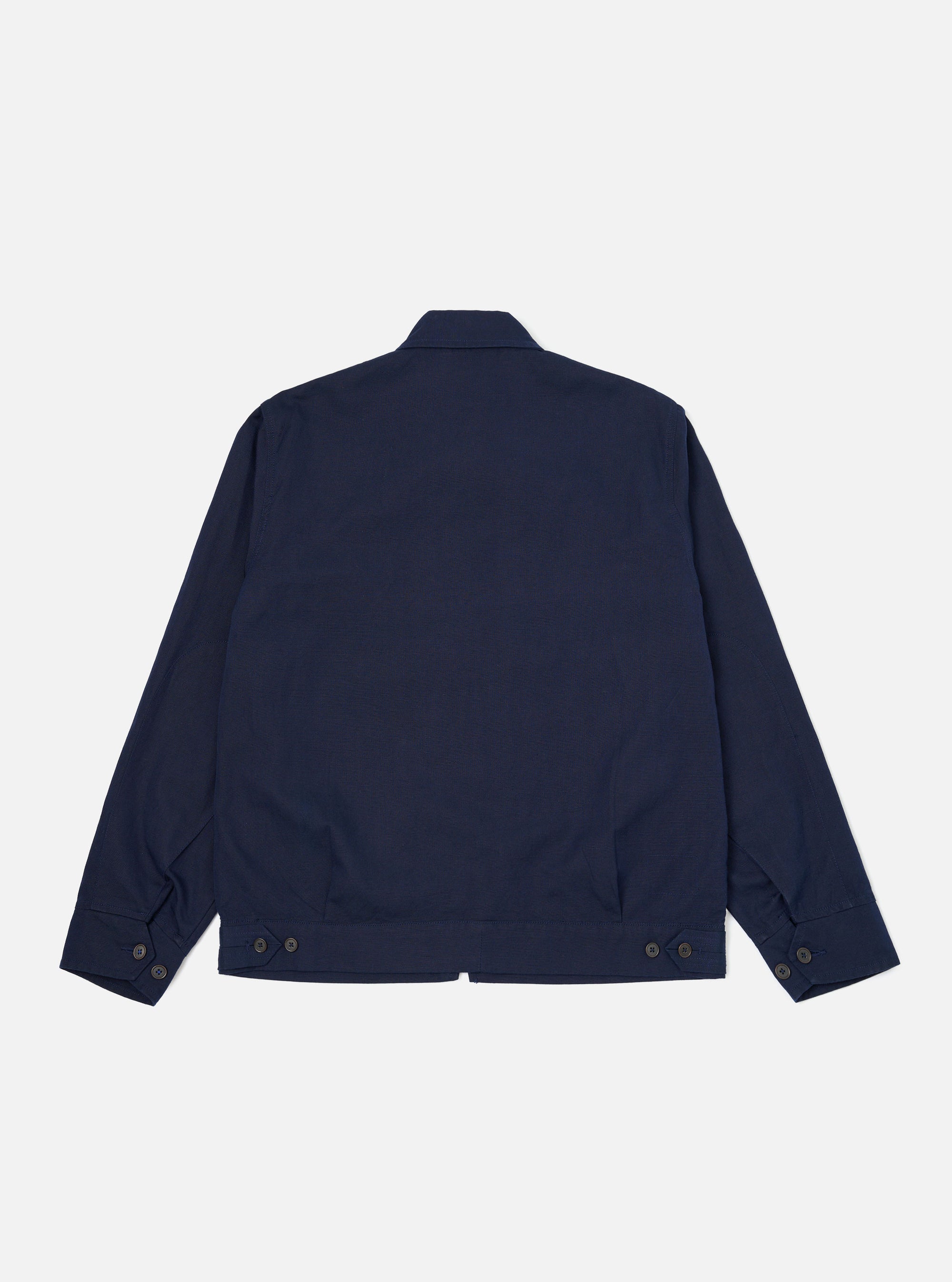 The Navy Linen Slub Weave E130 Jacket is shown from the back, laid flat against a solid white background. The image highlights the textured linen-cotton fabric, the straight hem, and the clean stitching along the shoulders and sleeves.