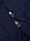 The Navy Linen Slub Weave E130 Jacket is shown from the back, laid flat against a plain white background. The image highlights the garment's simple, clean construction, featuring a straight hem and a classic collar.