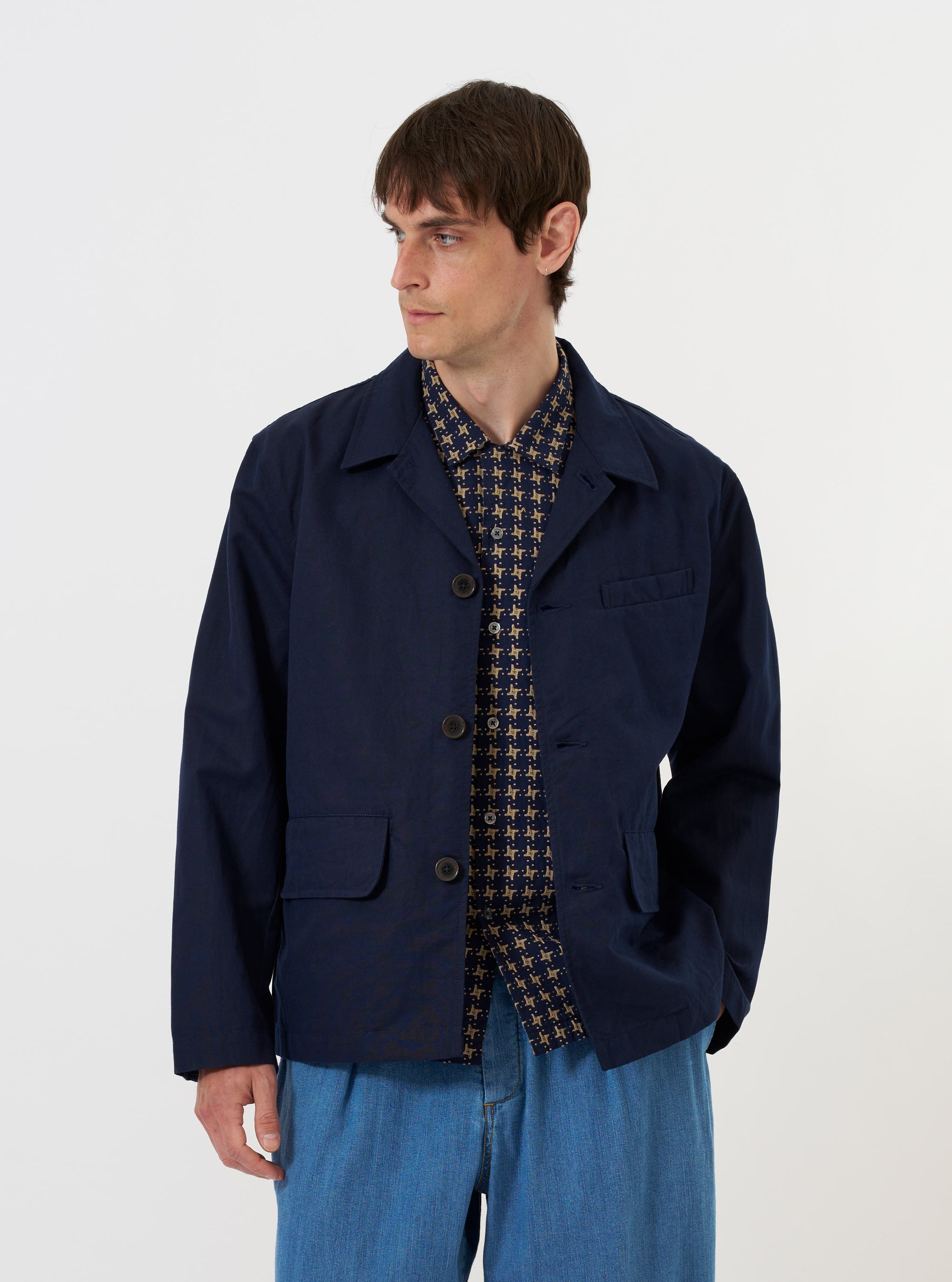 The Navy Linen Slub Weave Franck Jacket is shown laid flat against a solid white background. The garment features a navy blue textured slub weave, a classic pointed collar, a full-length silver zipper, and two vertical zip pockets on the front.