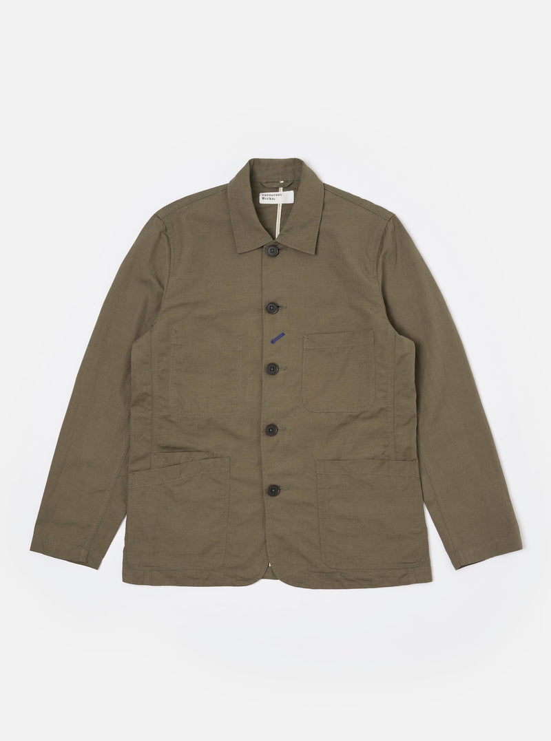 The Olive Linen Slub Weave Bakers Jacket is displayed as a flat lay against a plain white background. The jacket features a five-button front closure, a structured collar, and four front patch pockets: one at the chest and three at the waist, including a smaller ticket pocket. The olive green fabric shows a visible slubbed texture.