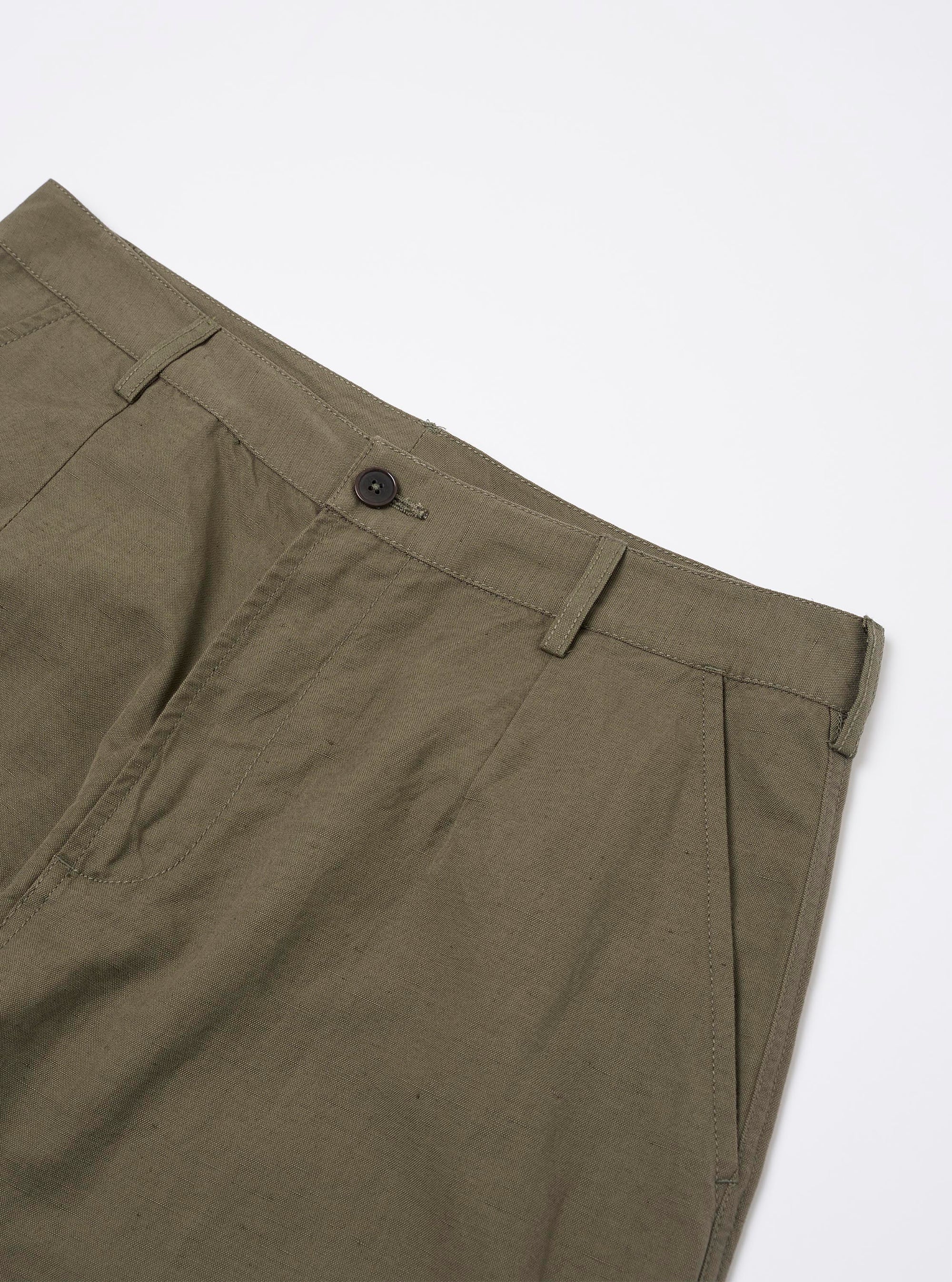 The Olive Linen Slub Weave Dizzy Trouser is shown from a rear perspective, laid flat against a solid white background. The image highlights the two rear buttoned flap pockets, the fixed waistband, and the textured olive green slub weave fabric.