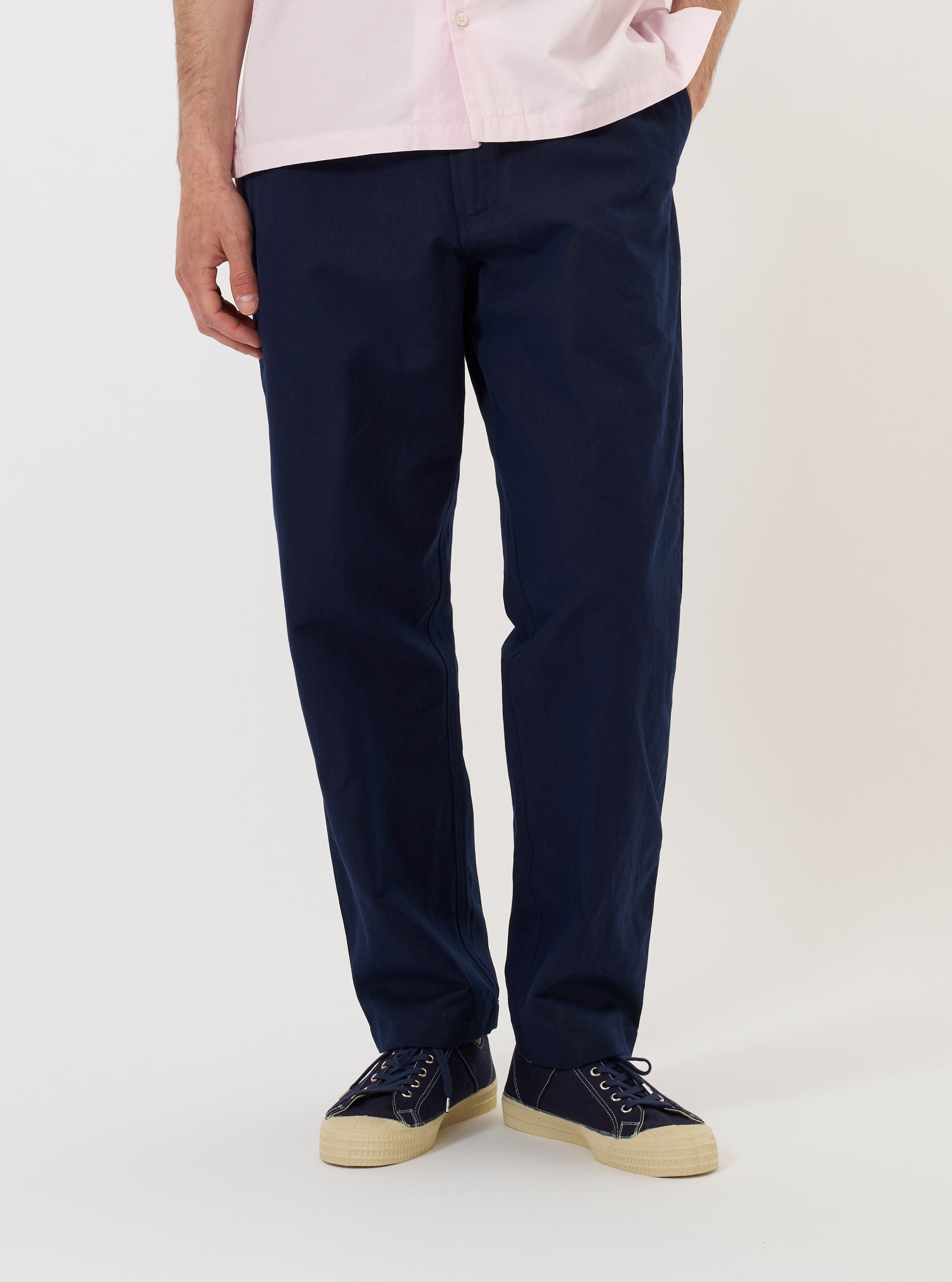 A pair of Navy Linen Slub Weave Dizzy Trousers is shown laid flat against a solid white background. The trousers feature a wide, loose-fitting leg and are crafted from a textured navy blue slub weave fabric.