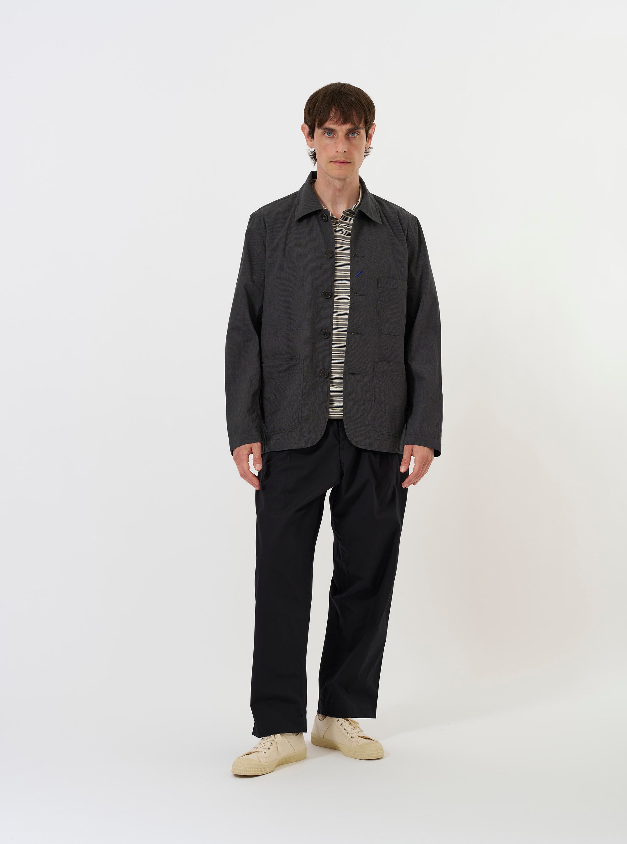 A Charcoal Seattle Cotton OG Bakers Jacket is shown laid flat against a solid white background. The jacket features a classic pointed collar, a five-button front closure with a decorative contrast buttonhole, and multiple front patch pockets with angled corners.