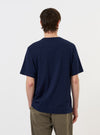 The Navy Single Jersey Multi UW Print Multi UW Print Tee is displayed flat against a plain white background. The navy blue t-shirt features a crew neck, short sleeves, and a prominent four-color graphic print on the chest consisting of graduated rectangular bars.