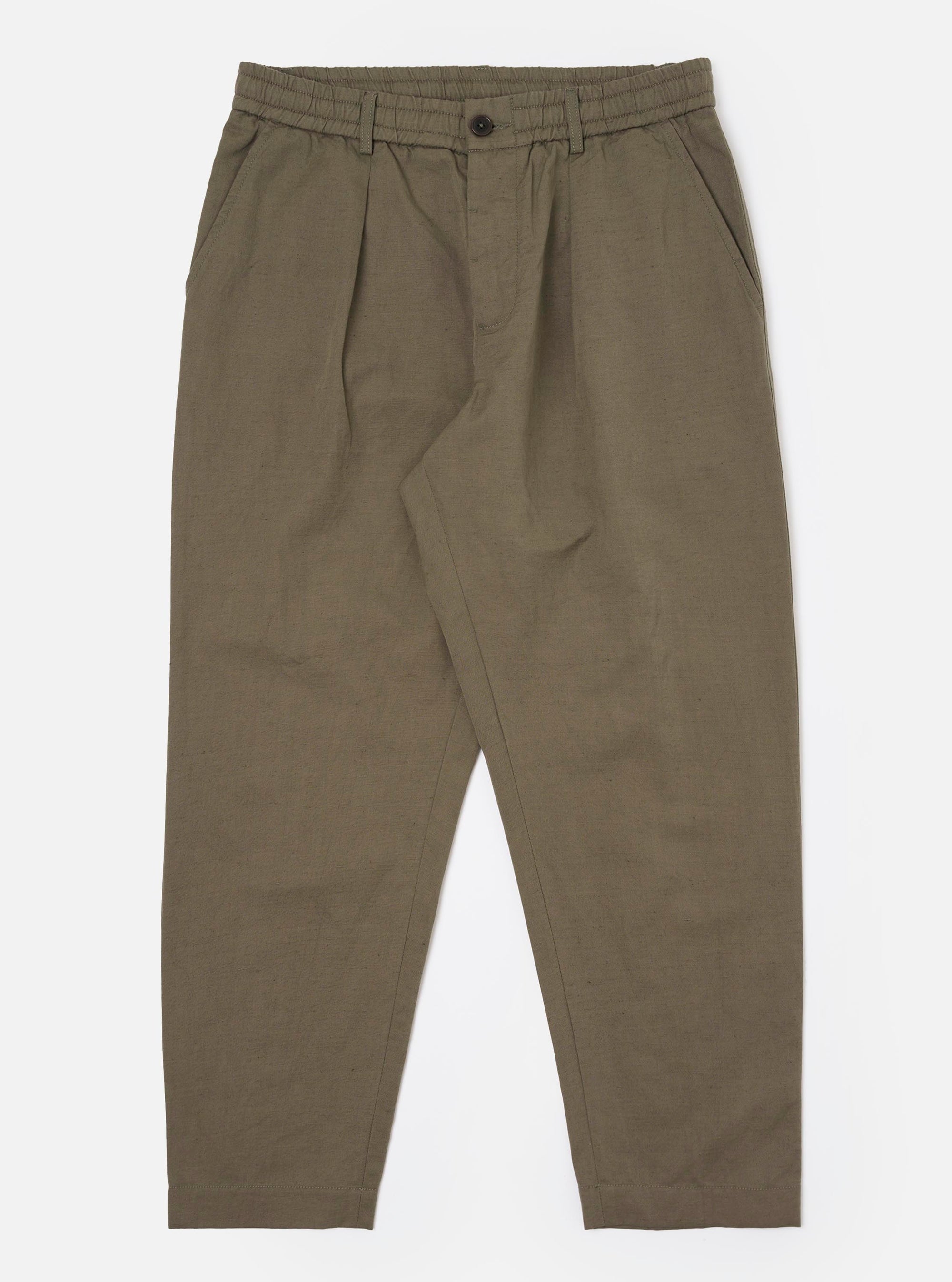 The Olive Linen Slub Weave Oxford Pant is shown as a flat lay against a plain white background. The trousers feature an elasticated waistband with a tonal drawstring, a single pleat on the front of each leg, and a wide, slightly tapered silhouette. The olive green fabric has a visible, irregular slub texture.