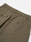 A pair of olive green linen slub weave Oxford pants is shown from the back, laid flat against a plain white background. The image highlights the elasticated waistband and two rear pockets, one with a buttoned flap and one jetted, showcasing the textured slub fabric.