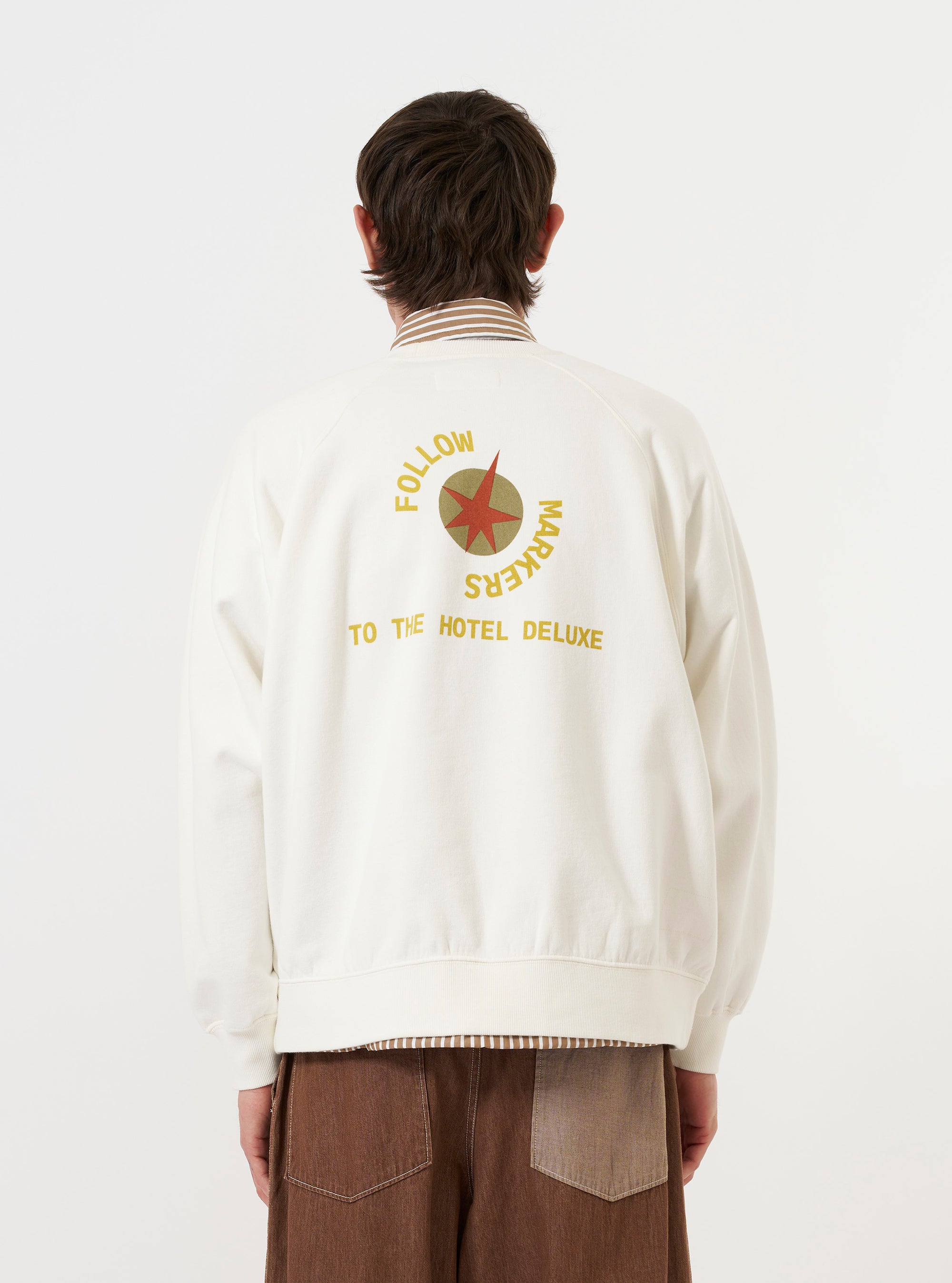 A model is wearing the Ecru Brush Back Sweat FM Raglan Sweatshirt against a plain white background. The image, taken from a rear perspective, highlights the raglan sleeve detailing and the ribbed texture of the collar, cuffs, and hem.