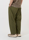 The Olive Broadcloth Oxford Pant is displayed flat against a plain white background. The image focuses on the rear of the trousers, highlighting the elasticated waistband with belt loops and two rear pockets: one a buttoned flap pocket and the other a jetted buttoned pocket. The wide, loose leg silhouette is clearly visible.