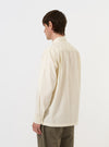 The back of the Ecru Broadcloth Lucky Shirt is shown laid flat against a plain white background. The image highlights the horizontal back yoke and the smooth texture of the ecru cotton broadcloth.