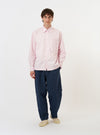 The Pale Pink Broadcloth Lucky Shirt is displayed flat against a plain white background. The long-sleeve shirt features a classic pointed collar, a full button-down front, a single square chest pocket on the left side, and a straight hem.