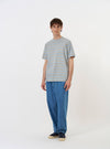 The Pale Blue OS Stripe Jersey Core Tee is shown laid flat against a solid white background. The short-sleeved T-shirt features a light blue and white horizontal stripe pattern, a ribbed crew neckline, and a straight hem.