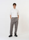 The White Poplin Frill Shirt is shown laid flat against a plain white background. The shirt features a crisp white poplin fabric, a standard collar with frill edging, a full button-down front, and long sleeves.
