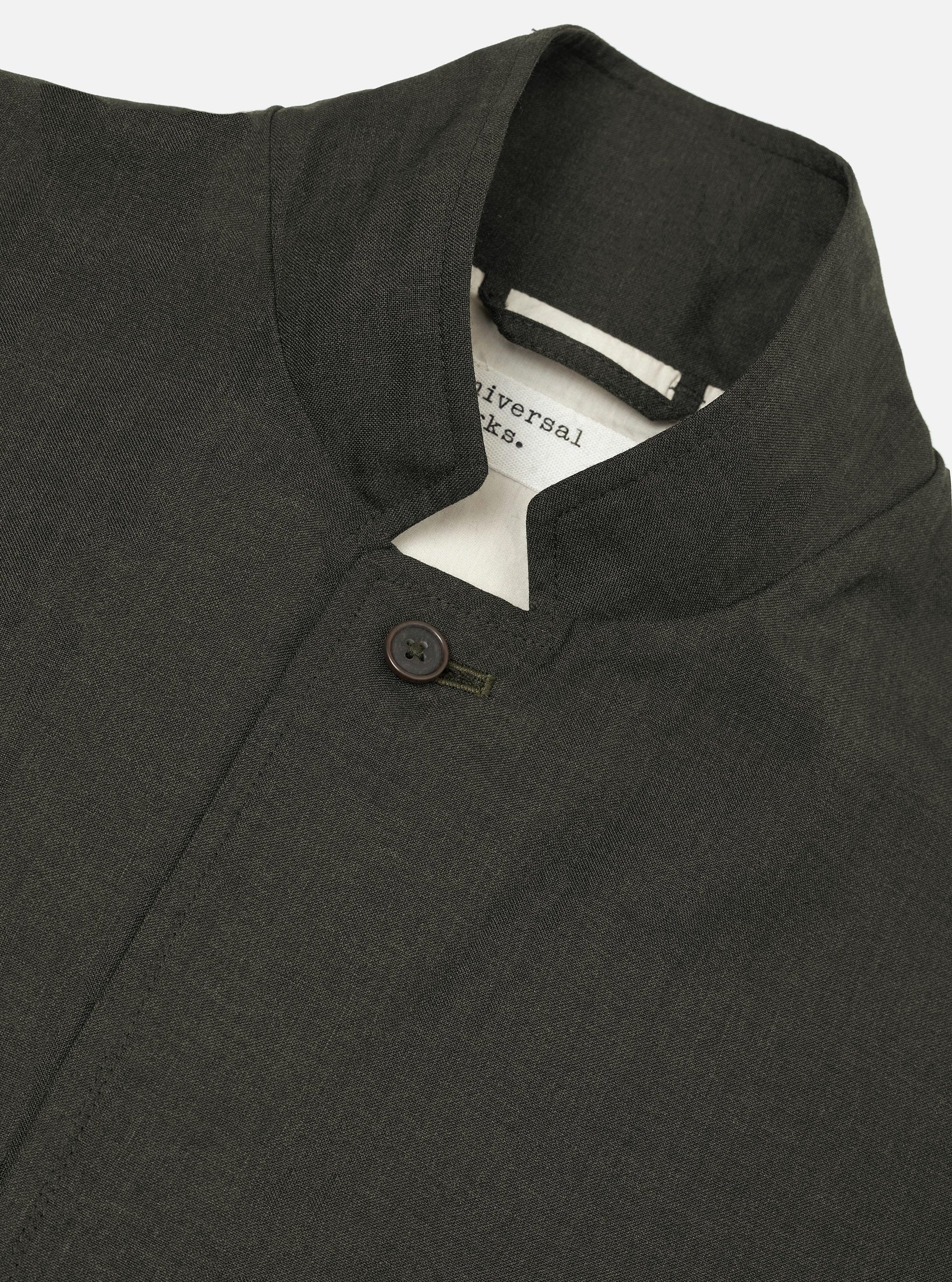 An Olive Marl Tropical Suiting Two Button Jacket is shown from the back, displayed flat against a plain white background. The image highlights the jacket's relaxed fit, two-piece sleeves, and clean hemline.