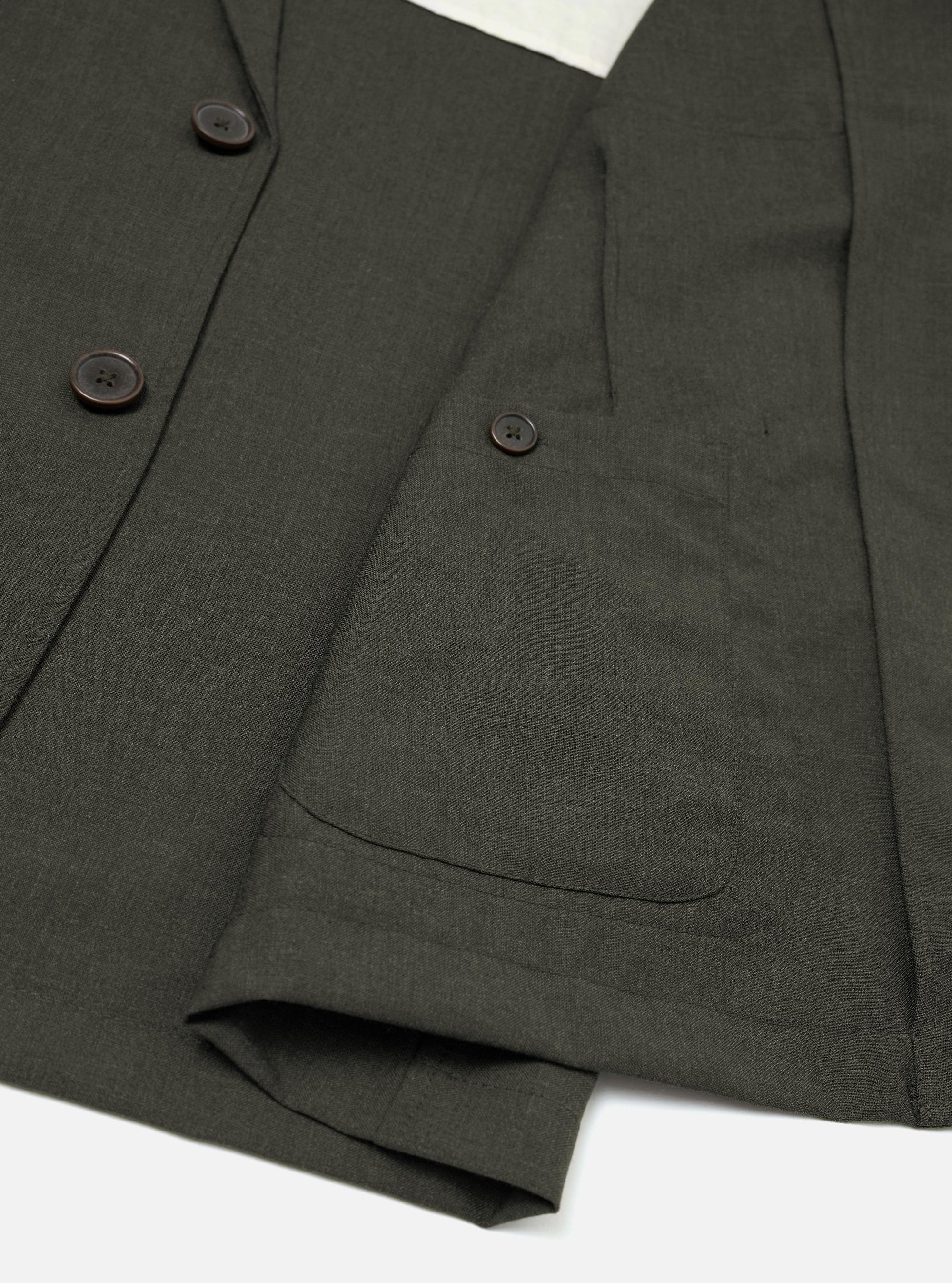 The Olive Marl Tropical Suiting Two Button Jacket is shown from a rear perspective, laid flat against a solid white background. The image highlights the unstructured, clean design of the back, the two-piece sleeve construction, and the subtle texture of the olive marl wool-blend fabric.